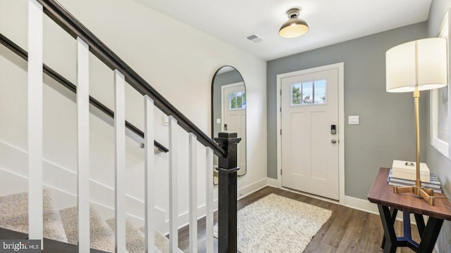 foyer with dark wood-type flooring