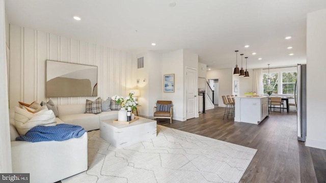 living room with dark hardwood / wood-style floors