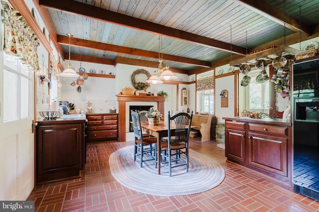 dining area with beam ceiling