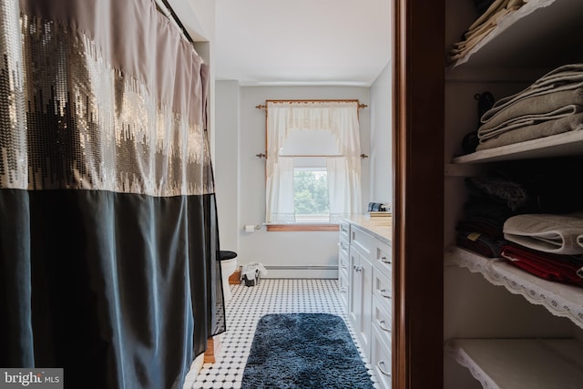 bathroom featuring vanity and a baseboard heating unit