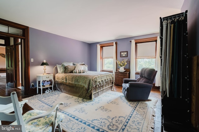 bedroom with wood-type flooring