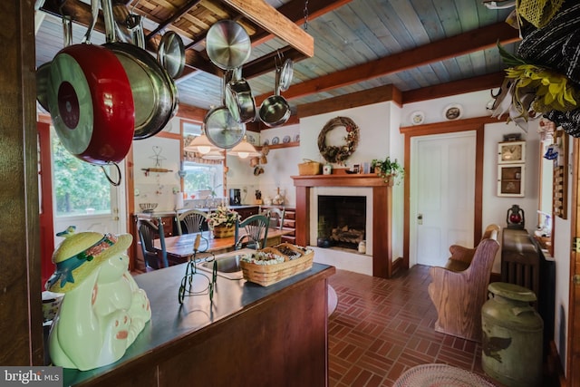 living room featuring beamed ceiling and sink