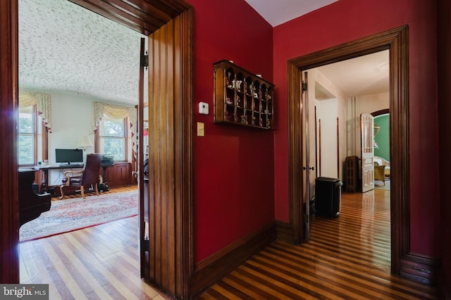 corridor featuring wood-type flooring