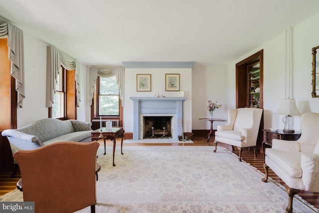 living room featuring hardwood / wood-style flooring and radiator