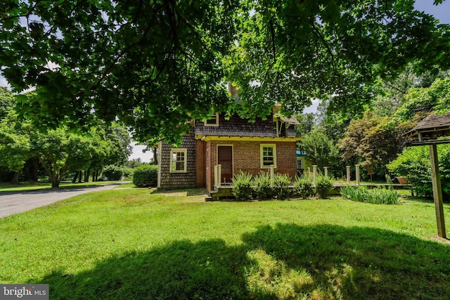 view of front of home with a front yard