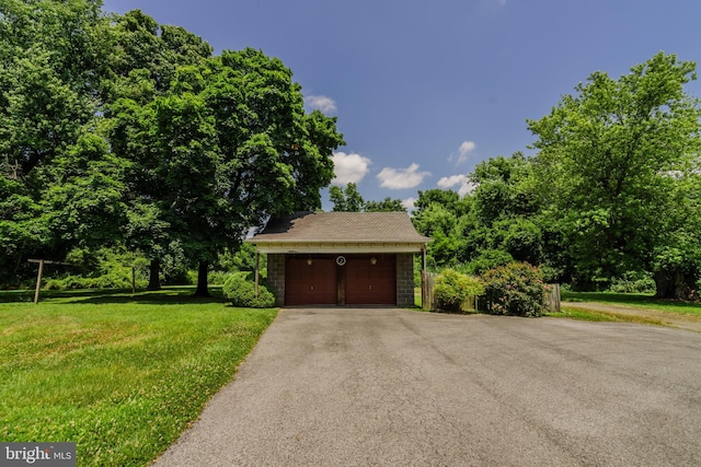 garage with a yard