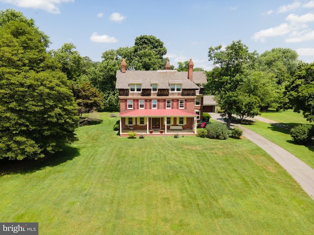 exterior space featuring a porch and a front lawn