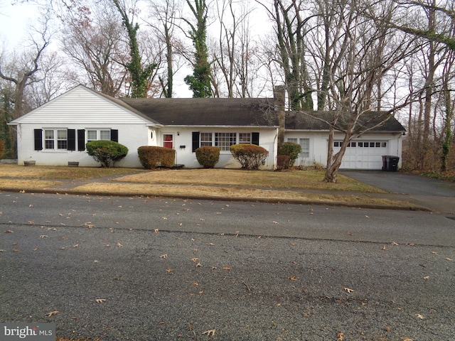 ranch-style house featuring a garage