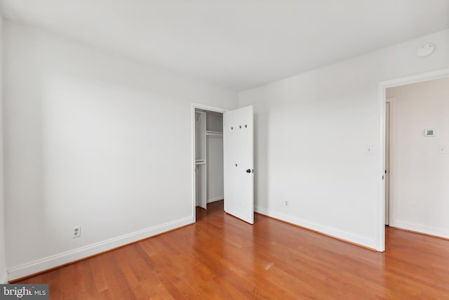 unfurnished bedroom with wood-type flooring