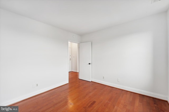 unfurnished room featuring wood-type flooring