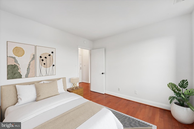 bedroom featuring hardwood / wood-style flooring