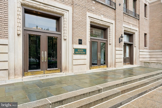 view of exterior entry featuring french doors