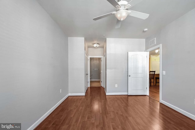 unfurnished bedroom with hardwood / wood-style floors and ceiling fan