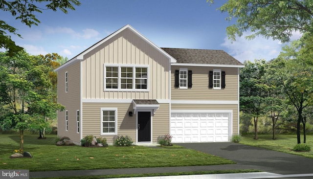 view of front of property with a front yard and a garage