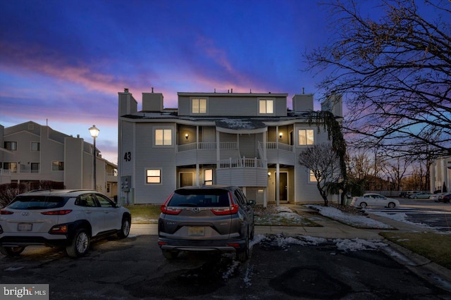 view of front of house featuring a balcony