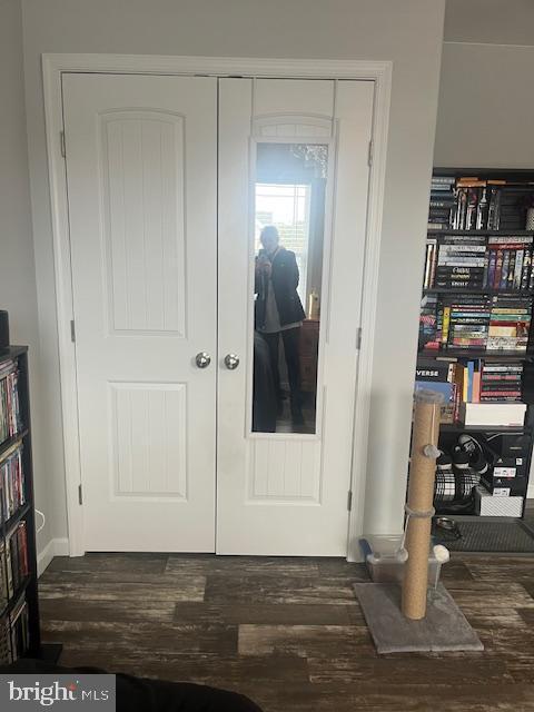 interior space featuring dark hardwood / wood-style floors and french doors