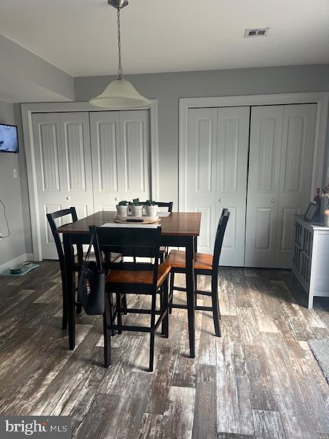 dining area with wood-type flooring