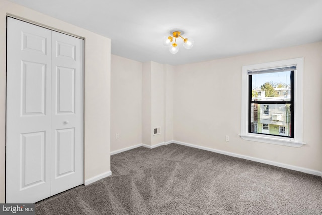 spare room featuring carpet floors