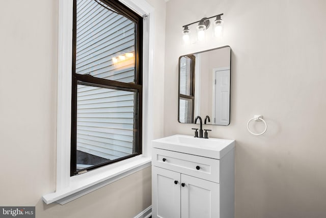 bathroom with vanity and a healthy amount of sunlight