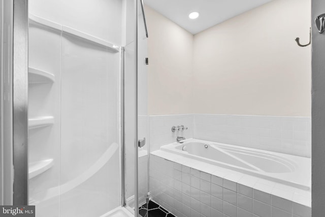 bathroom with plus walk in shower and tile patterned flooring