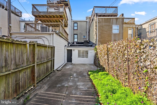 back of property featuring central air condition unit