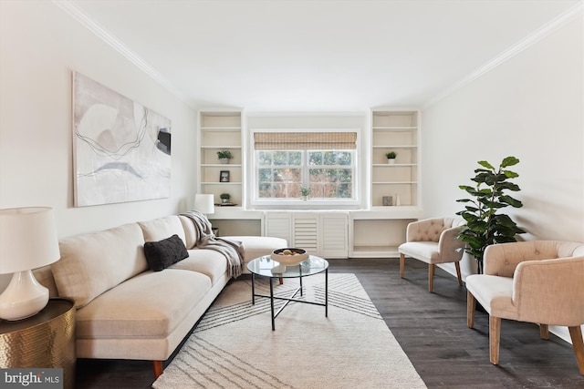 living room with dark hardwood / wood-style flooring, built in features, and ornamental molding