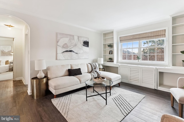 living room featuring ornamental molding and dark wood-type flooring