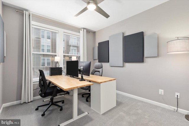 office area with ceiling fan and light carpet