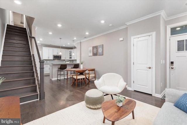 living room featuring crown molding and dark hardwood / wood-style floors