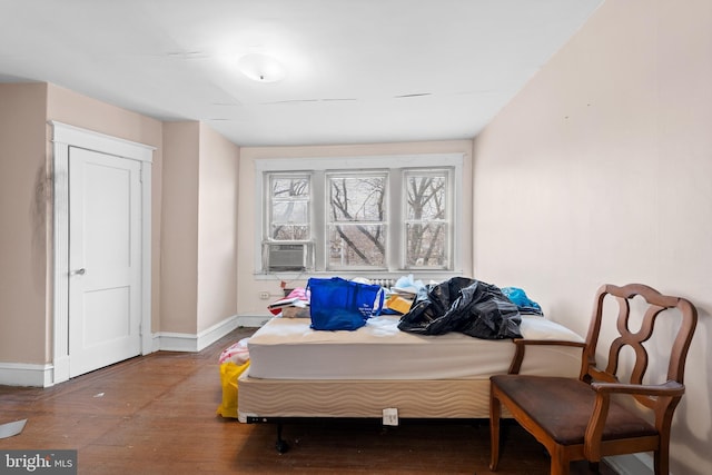 bedroom with hardwood / wood-style flooring