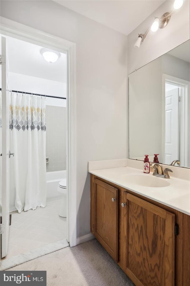 full bathroom featuring vanity, shower / bath combination with curtain, and toilet