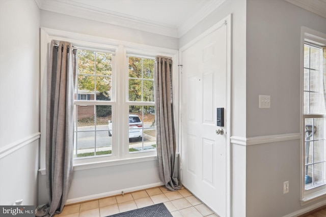 entryway featuring crown molding, light tile patterned floors, and a healthy amount of sunlight