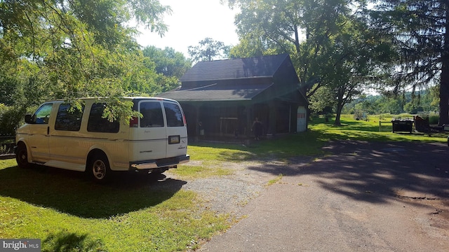 view of property exterior with a yard