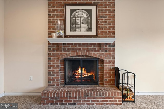 interior details featuring carpet and a fireplace