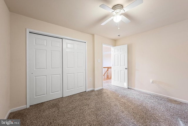 unfurnished bedroom with carpet flooring, a closet, and ceiling fan