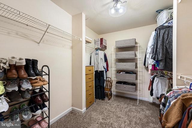 spacious closet with carpet flooring