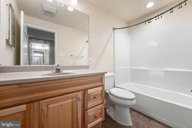 full bathroom featuring toilet, shower / bathing tub combination, vanity, and tile patterned floors