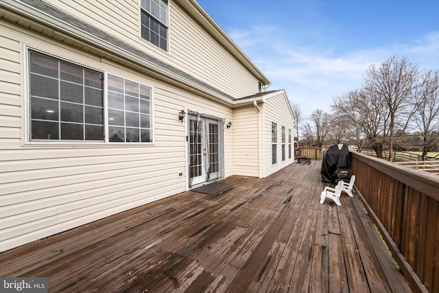 wooden terrace featuring area for grilling