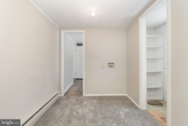 hall featuring a baseboard radiator, baseboards, and carpet flooring