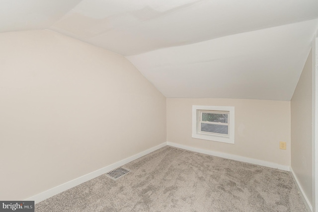 bonus room featuring carpet, lofted ceiling, visible vents, and baseboards