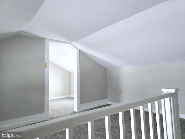 bonus room featuring carpet flooring, baseboards, and lofted ceiling