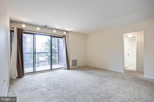 6711 Park Heights Ave Unit 207, Baltimore, MD 21215 - carpeted empty room with baseboards