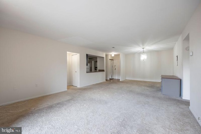 6711 Park Heights Ave Unit 207, Baltimore, MD 21215 - spare room with light colored carpet and baseboards