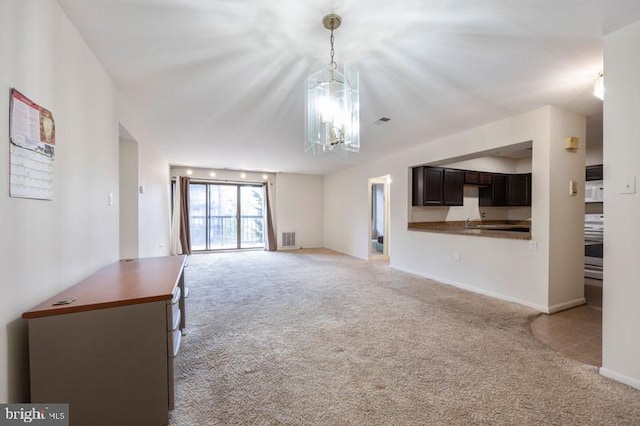 6711 Park Heights Ave Unit 207, Baltimore, MD 21215 - unfurnished living room featuring light colored carpet