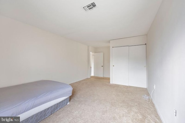 6711 Park Heights Ave Unit 207, Baltimore, MD 21215 - bedroom with light colored carpet and a closet