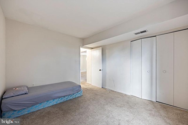 6711 Park Heights Ave Unit 207, Baltimore, MD 21215 - unfurnished bedroom featuring carpet and a closet