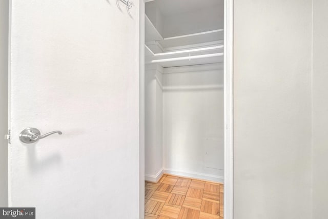 spacious closet featuring light parquet flooring