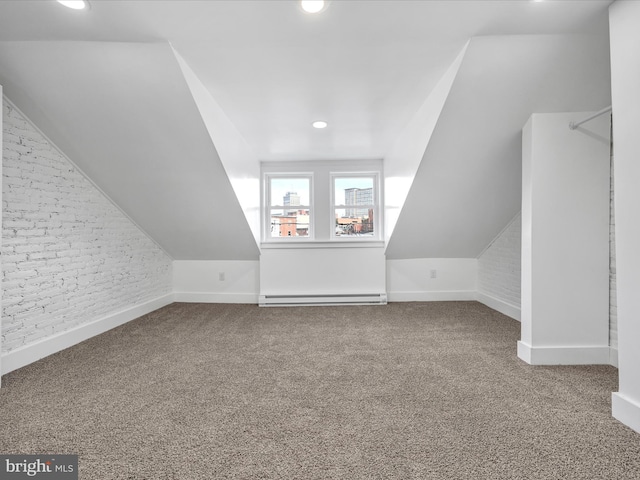 additional living space featuring carpet, lofted ceiling, and a baseboard radiator