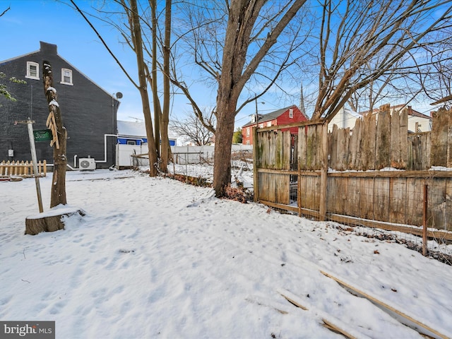 view of yard layered in snow