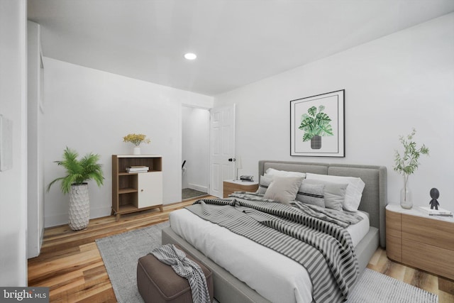 bedroom featuring light hardwood / wood-style floors